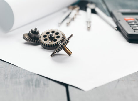 Engineering supplies and blueprints on workplace