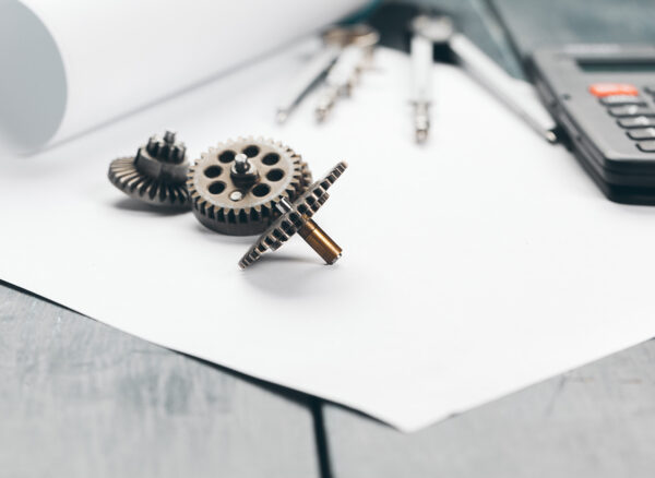 Engineering supplies and blueprints on workplace